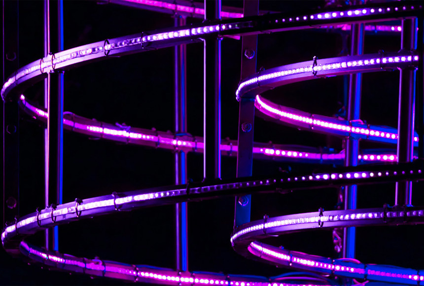 Image of gasworks with neon lighting
