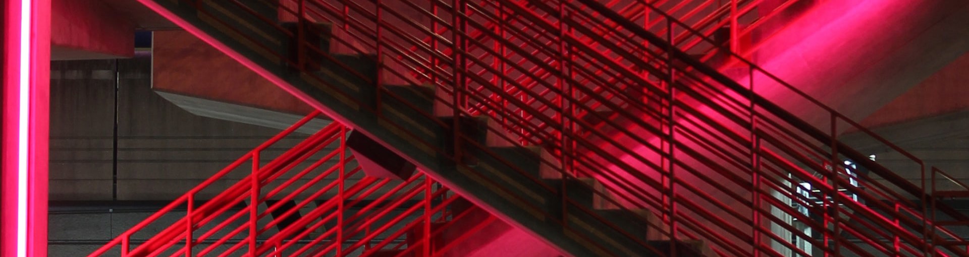 Image of red stairs in neon light