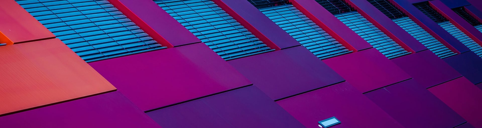Abstract image of building with purple and blue panels and window frames