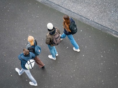 A row of young people walking shot from a birds eye view